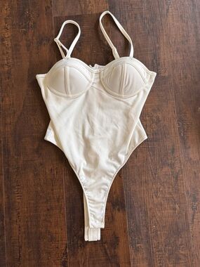 Cream One-Piece Bodysuit with Structured Cups